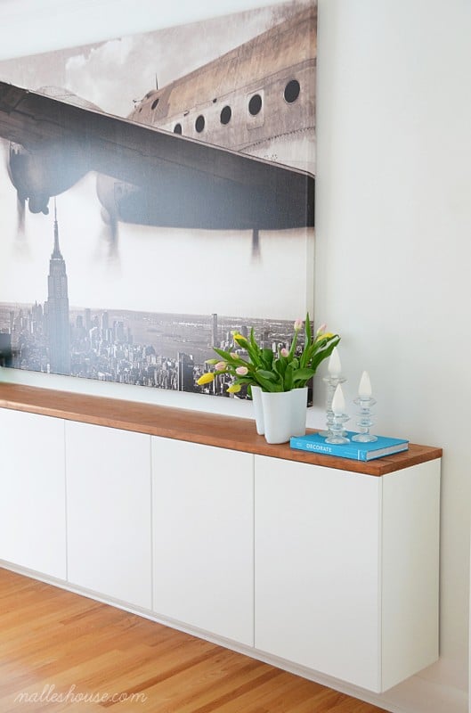 modern dining room with large art and floating sideboard