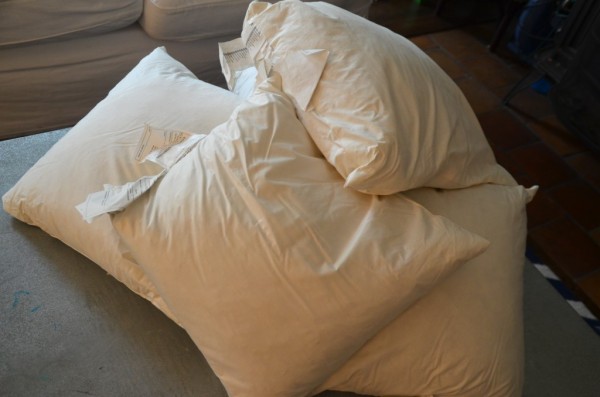 use old pillows to stuff a floor pouf, featured on Remodelaholic.com