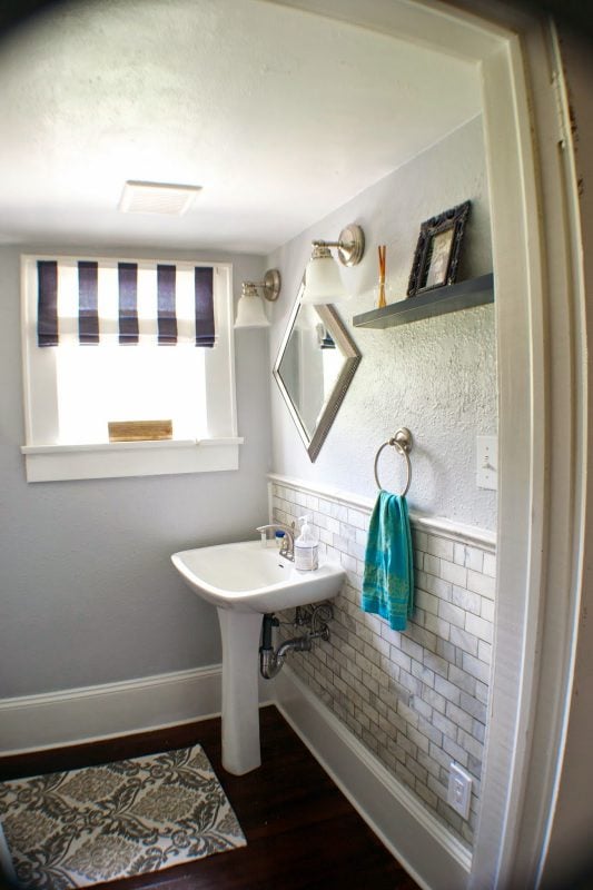 Complete Remodel! Storage Room Into Half Bath | Seesaws and Sawhorses via Remodelaholic.com #remodel #beforeandafter #marble #subwaytile