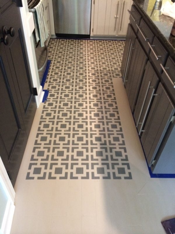 WOW! Paint and stencil your kitchen floors for high impact on a tiny budget! Full tutorial by Designer Trapped in a Lawyer's Body for Remodelaholic.com!