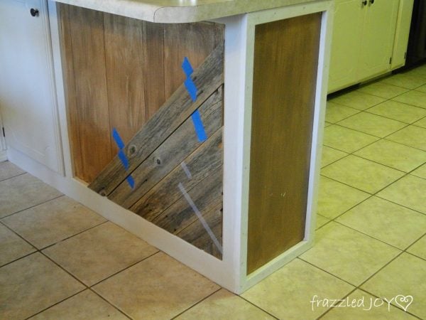 use painter's tape to hold planks to kitchen island, Frazzled Joy on Remodelaholic