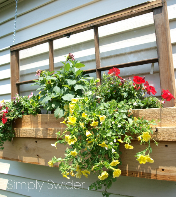 Simply Swider - old window into outdoor planter window box decoration - via Remodelaholic